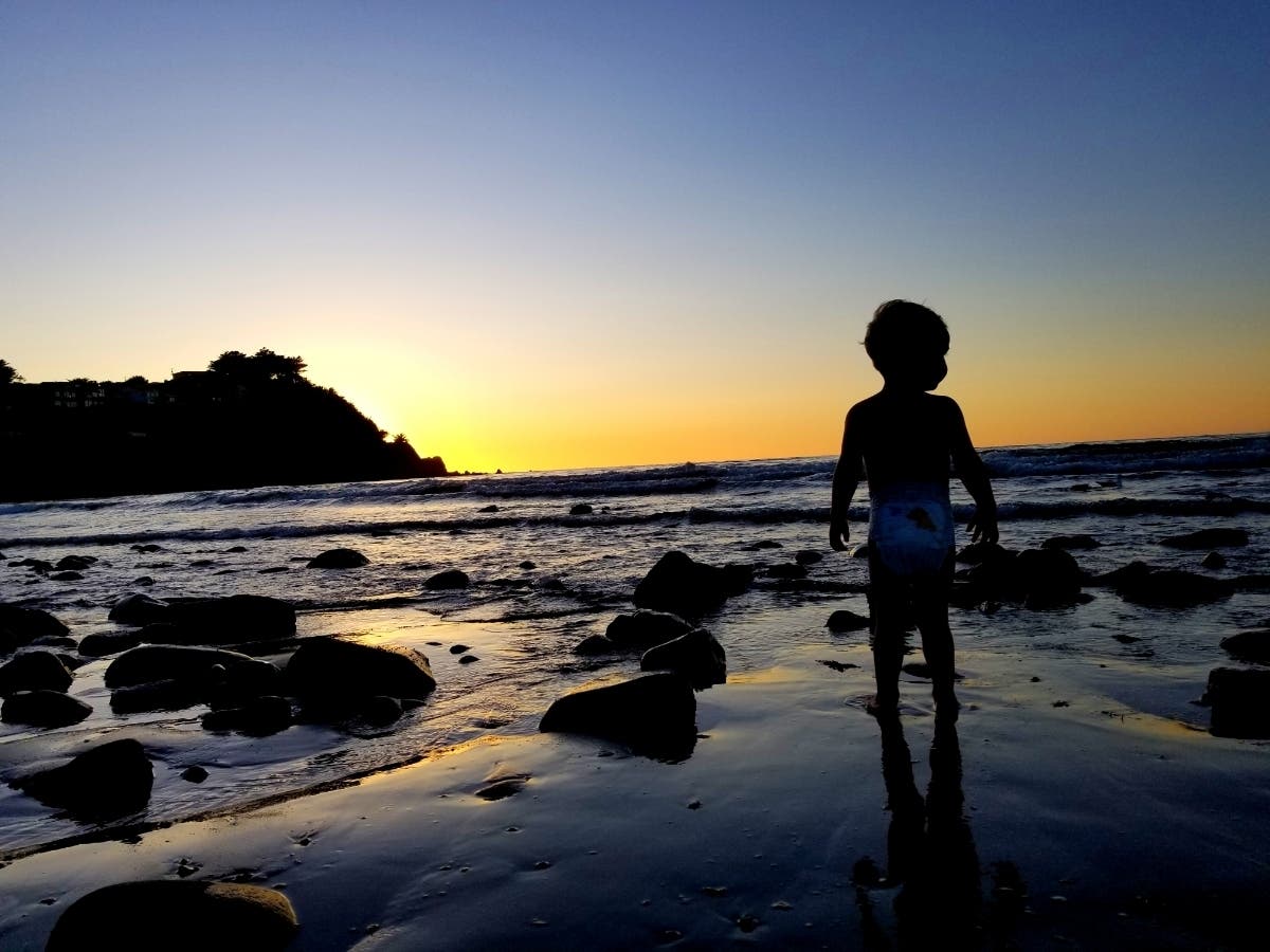A 2-year-old photographed while the sun sets over Pedro Point in Pacifica, CA.