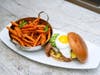 The Rooftop Lounge's signature cheeseburger with white Pepper Jack cheese, fried egg and “Del Camino Sauce."