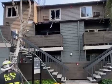 Alameda County Fire Department crews knock down an apartment fire Sunday afternoon.