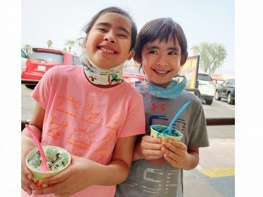 "Grand twins" treated to ice cream on outing in Palm Desert, CA.