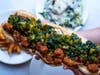 Take home Cassia's “La Zi Ji” - a spicy popcorn chicken hoagie - for Game Day.