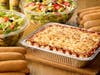 A large pan of classic lasagna, plus salad & breadsticks, are among Olive Garden's takeout options to celebrate Easter at home.
