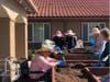 Anthem Memory Care residents plant flowers in new raised beds in Murrieta.