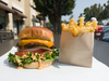 iniBurger's Angus Beef Americano Halal burger with fries.
