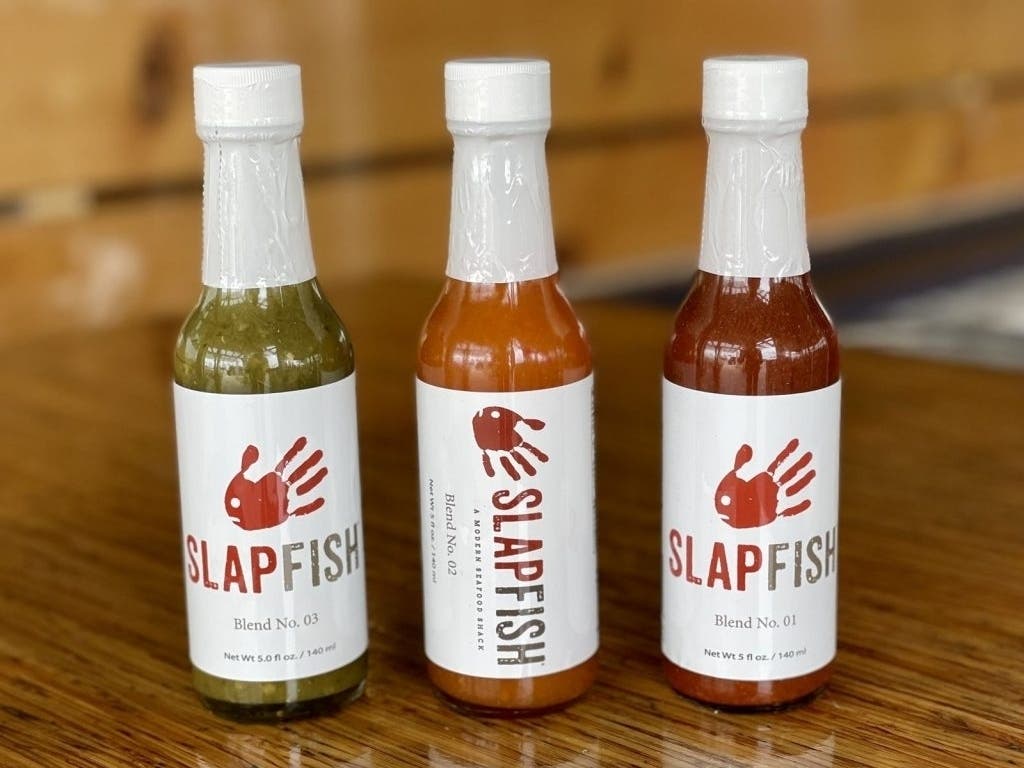 Seafood eatery Slapfish, started in Huntington Beach, CA, now has signature hot sauces for sale online.