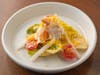 Chīsai Sushi Club's Crab Louie: little gems with Louie dressing, topped with dungeness crab, tomato, cucumber, pickled daikon and shaved, miso-cured egg yolk