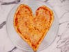 Enjoy a Valentine's Day, heart-shaped pizza - "a slice of New York" - from Joe's Pizza, with six LA-area locales.