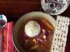 Matzo ball soup, homemade matzo, Bubbe’s Pecan Charosset, white fish albondigas and apple strudel are on the Passover dine-in or to-go menu at Canela in San Francisco.