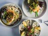 Outpost Kitchen's new spring menu includes (from left) Pacific Alaskan halibut, Willapa Bay oysters and wild-caught Alaskan king salmon.