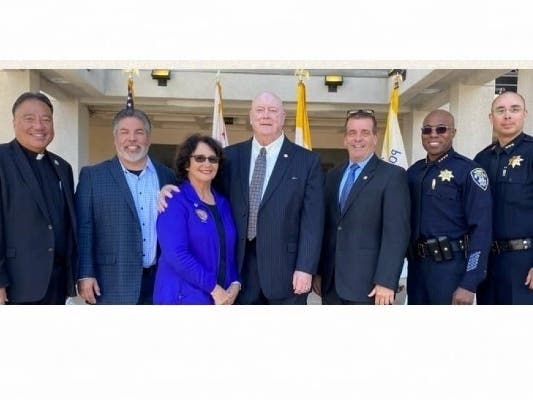 Retired San Leandro Police Chief Robert J.P. Maginnis (center) was honored in March with the naming of the Robert J.P. Maginnis Police Administration Building in San Leandro, CA.