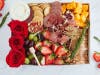 Surprise Mom with a charcuterie gift, including roses, cheeses, meats, fruits & more for Mother’s Day from Luxe Bites LA.