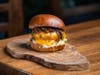 Haute Mess in L.A. recommends its "The Mess Burger" (signature beef blend, caramelized onions & bacon aioli) for those celebrating National Hamburger Day on May 28.