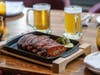 A takeout, BBQ feast for two is among July 4th specials offered for dine-in or to-go at International Smoke In San Francisco.