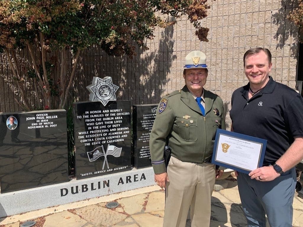CHP Dublin Area Commander, Capt. Christopher Sherry (left) honors Jason Elliot, a medical worker, for his bravery, expertise and assistance at an Aug. 17 crash on Interstate 580 near North Livermore Avenue. 
