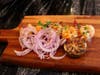 Sweet and Chili Tiger Shrimp is among new elevated Christmas dishes offered at Khan Saab Desi Craft Kitchen for dine-in & to-go in Fullerton.