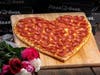 Warm hearts with heart-shaped pizzas, available for entire month of February, from Pizza Guys stores.