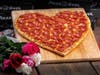 Warm hearts with heart-shaped pizzas, available for entire month of February, from Pizza Guys stores.