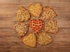 Papa Johns' heart-shaped pizzas -- thin crust with cheese & toppings -- are offered through Valentine's Day. 
