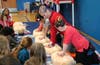Physical Education teacher Beth Bolger demonstrates Hands-only CPR