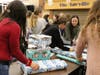 Students wrappedgifts in advance of Every Child's Dream Dinner Holiday.