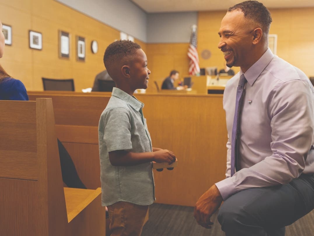 Court Appointed Special Advocate meets with child in court