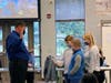 Rick Lloyd is sworn in by members of his family.