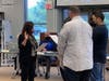 Family members swear in newly elected member Patty Chlada.