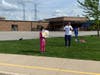 Members of the Compassion in Action club made signs to cheer on the girls.