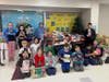 Students from Kruse show of some of the items that were collected during their toy, book, and pajama drive in December.