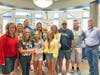 The three CMS students pose with their families and Dr. Nolan and Dr. Couwenhoven.
