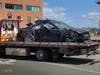 A heavily damaged vehicle is hauled away from the scene of a crash in Stamford around 12:30 p.m. on Aug. 26, 2019.