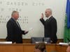 Trustee Mark Hyer administers the oath of office to Police Recruit James Gunnels, Jr.