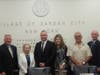 Trustee Mark Hyer, Mayor Theresa Trouvé, Recruit James Gunnels, Jr., his parents and Commissioner Ken Jackson.