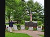 American Legion Commander Frank Tauches salutes the flag.