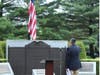 American Legion Post Commander Frank Tauches, Jr. salutes the flag.