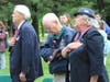 Veterans and members of the Auxiliary during the singing of the National Anthem.