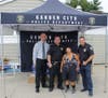 Commissioner Jackson, Detectives Roumeliotis and Hennessy with a resident member of the Garden City Pool.