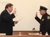 Deputy Mayor Thomas O’Brien administers the oath of office to Police Officer Peter Rozo.