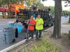 Recreation and Parks crew members Jessie Lyons and Tom Armato clean up the planting beds along Franklin Avenue before the start of weekend business Saturday July 23, 2022.