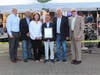Mayor Mary Carter Flanagan and (from left) Trustees Michael Sullivan, Lawrence Marciano, Jr., Bruce Chester and Charles Kelly recognized famed jockey Javier Castellano at the Belmont Festival on Seventh Street June 9, the eve of the Belmont Stakes.