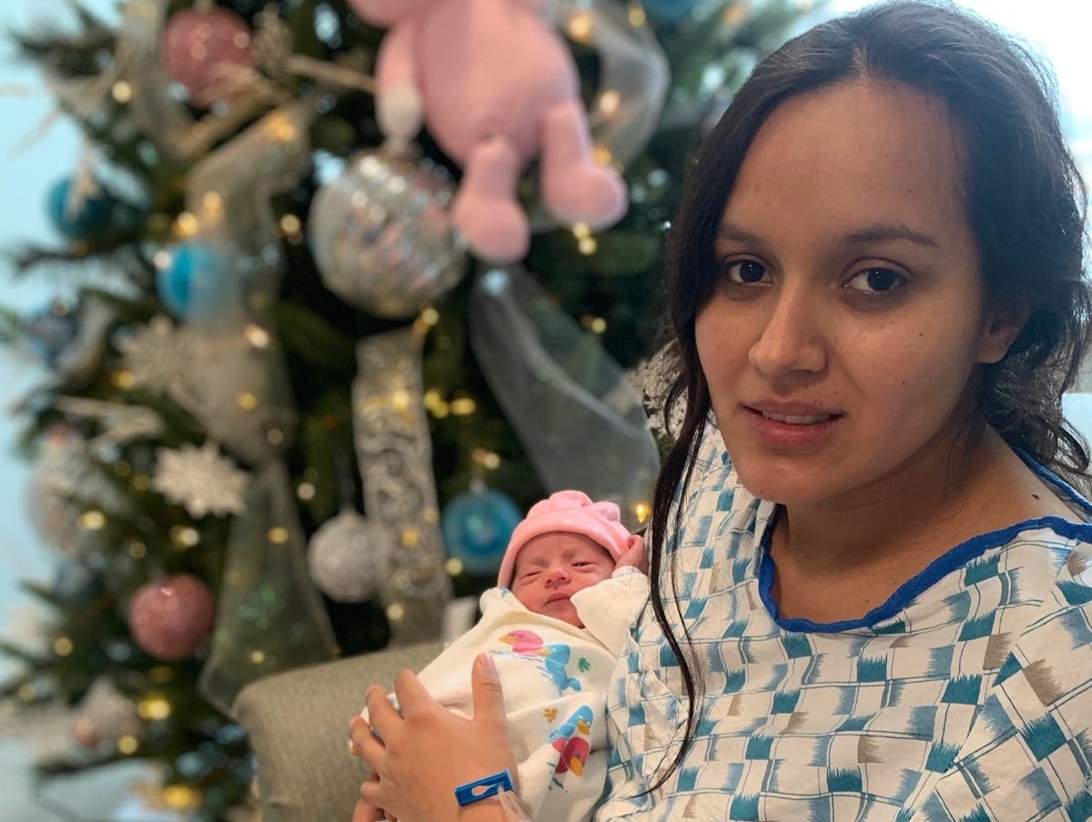 Sofia Garcia, the first baby born at Franciscan Health Olympia Fields in 2021, is held by her mother, Selena Garcia.