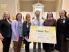 Representatives from Franciscan Health Olympia Fields thanked St. Agnes School students and staff for their generous donation during an all-school Mass at St. Agnes last week. 
