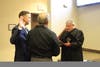Plymouth Township police officer Jonathan Marinelli is sworn in during Monday's Plymouth Township Council meeting.