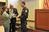Plymouth Township Council Chair Marty Higgins swears in fire police Tanya Zekovitch.