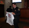 Players from the Plymouth-Whitemarsh High School baseball team presented Chief Joe Lawrence with a T-shirt. 