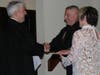 Judge Frank Bernhardt shakes Plymouth Township Police Chief John Myrsiades' hand after swearing him in.