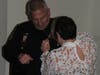 Plymouth Township Police Chief John Myrsiades has a new badge pinned on by his wife.