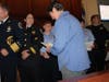 Plymouth Township Police Lt. Karen Mabry distributes commendations during Monday's Council meeting. 