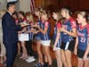 Plymouth Township Council Vice Chairman Chris Manero passes out commendations to the Plymouth Township Little League softball team, ages 10-12, while Council members congratulate players.