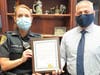 Plymouth Township Police Chief John Myrsiades recognizes Officer Holly Donohue.